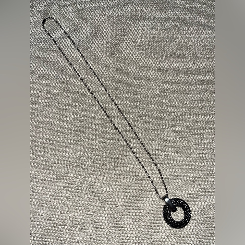 Stainless steel necklace and round pendant. NWOT